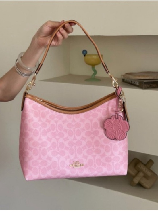Coach Handbags - Coach Pink Signature Shoulder Bag with Tan Trim and Floral Charm